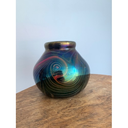 126 - John Ditchfield (British, 1952-) a iridescent purple studio glass vase with swirling pattern signed ... 