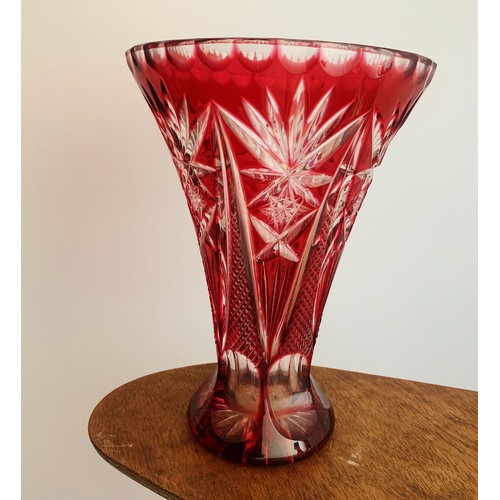 313 - A large Ruby overlay cut crystal glass vase, waisted form. Height 21cm.