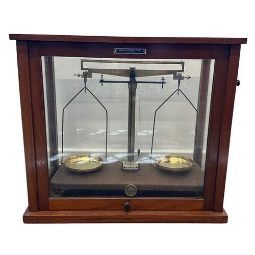 100 - Griffin & Tatlock laboratory scales in wooden and glass case with Griffin & George Limited plaque. C... 