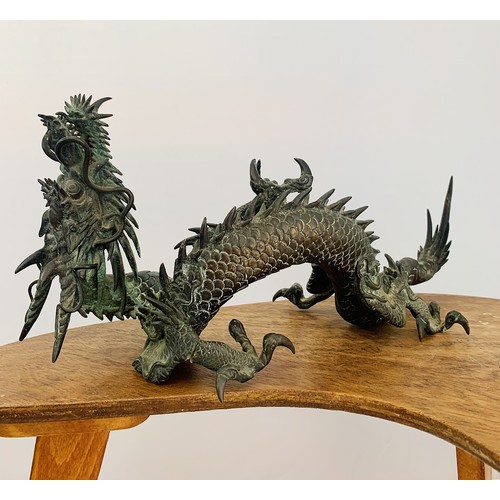 308 - Japanese large bronze model of a dragon, the creature resting on three legs with its head and arm ra... 