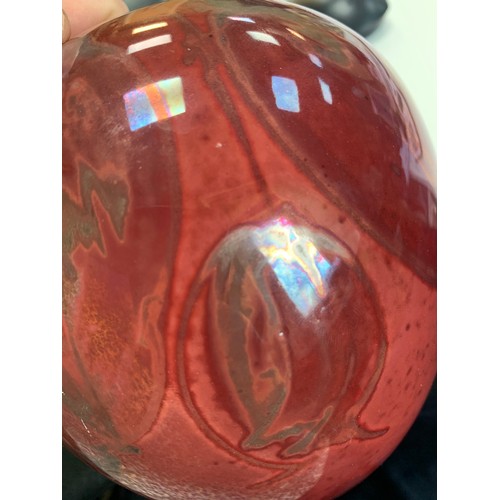 363 - A red Lustre ware hand painted vase, with hanging fruit decoration marked directly into the glaze. S... 