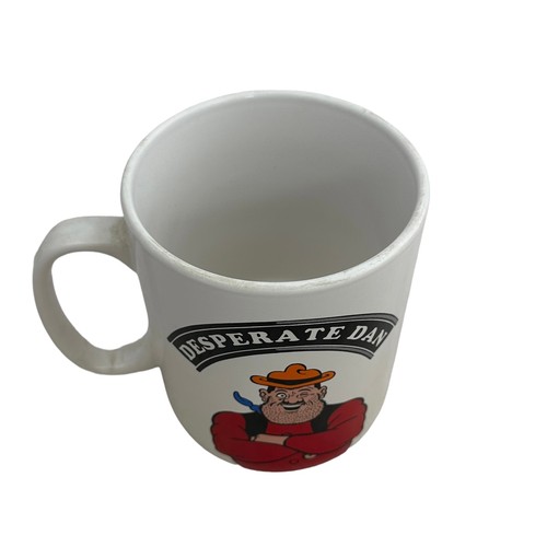 287 - Royal Doulton Dennis and Gnasher character mug D7005 (17cm in height) with Dennis The Menace soft to... 