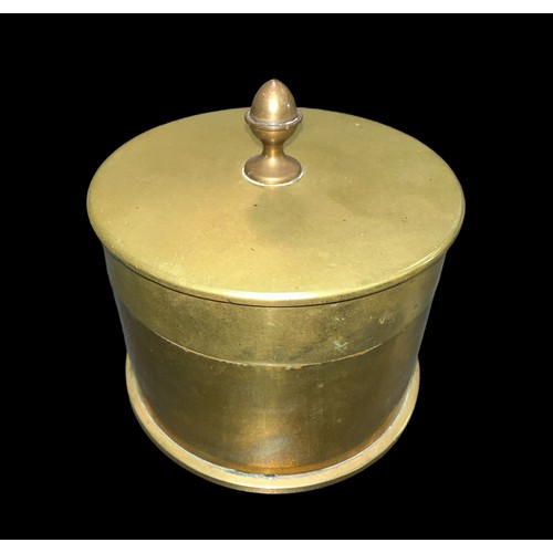 128 - Trench Art lidded Tobacco box made from an ammunition shell. Diameter 11cm.