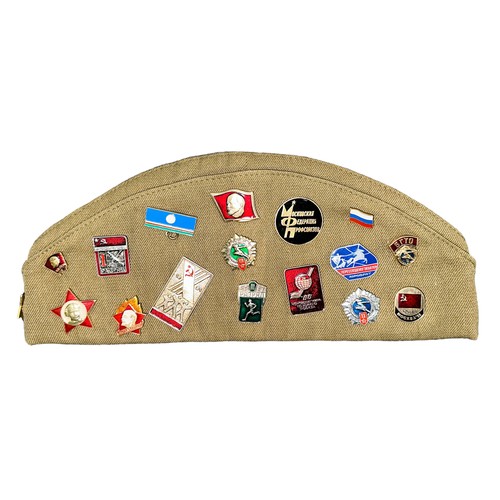 114 - Soviet Beret with selection of Soviet Pin Badges attached, total quantity of badges 32.