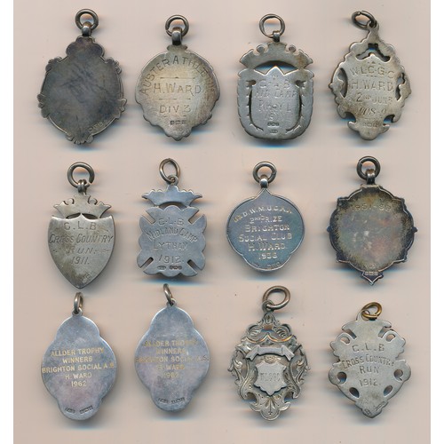 210 - Range of early 20th Century silver medals/fobs (12), all hallmarked sterling silver, one with 9ct go... 