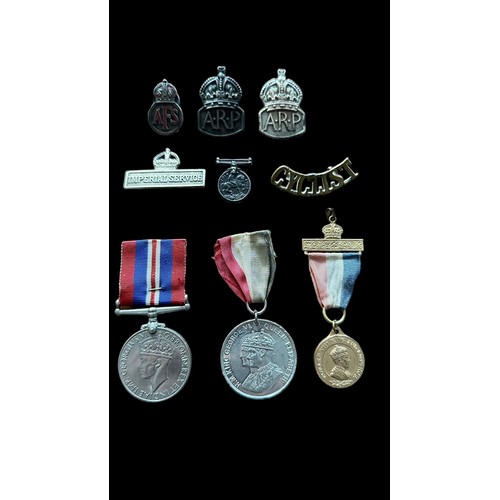 33 - Small selection of Medals & Badges to include; 1939-45 Medal, Silver ARP badge (x2), Silver AFS badg... 