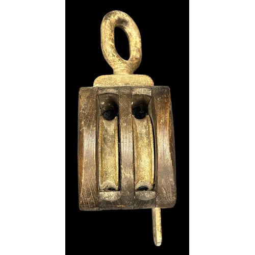 159 - Navy, a large ship’s wooden pulley, with cast metal loop to one end, loop marked SWL 1. SOTON J4 281... 