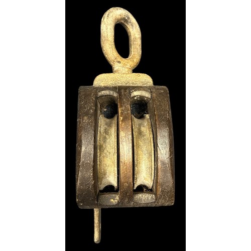 159 - Navy, a large ship’s wooden pulley, with cast metal loop to one end, loop marked SWL 1. SOTON J4 281... 