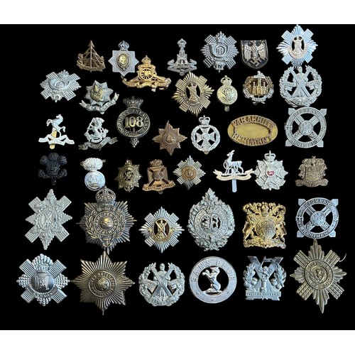 166 - Mixed lot of military cap badges etc (40), with examples of Madras Infantry, Highland Regiment, Argy... 