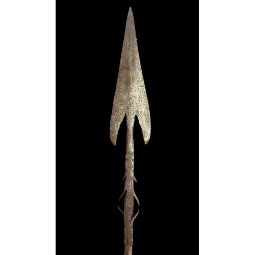 195A - Long Arrow head tipped shaped spear, three sets of barbed prongs to spear head neck with crosshatche... 