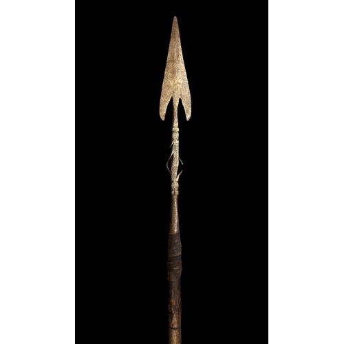 195A - Long Arrow head tipped shaped spear, three sets of barbed prongs to spear head neck with crosshatche... 