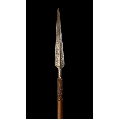 195 - Large long spear with very long leaf spear tip, brass studded leather handle grip, foliate decoratio... 