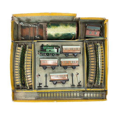 283 - Bing for Gamages. Tinplate 2-rail clockwork set No. 61/3600/5, generally excellent to good in good y... 