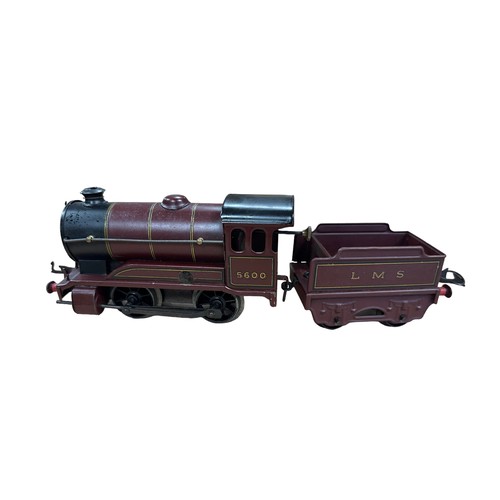 348 - Hornby O gauge clockwork with key LMS 5600 0-4-0T locomotive and LMS tender, generally excellent to ... 