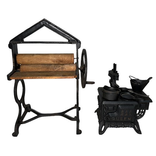 177 - Miniature Queen Cast Iron stove cooker, including accessories such as pots and pans. Plus, a Cast Ir... 