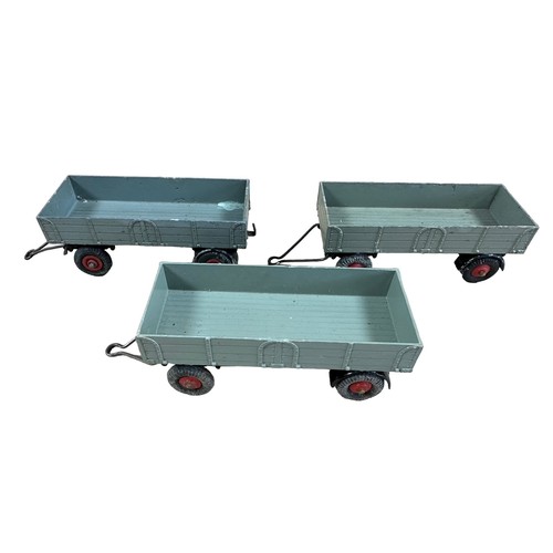 110 - Dinky Trade Pack of three Trailer No. 551, generally good plus to good (some axle corrosion and tyre... 