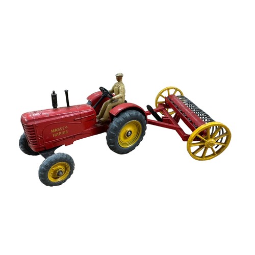 112 - Dinky Farm Tractor and Hay Rake No. 310, generally good plus in excellent Dinky Toys stripe lift-off... 