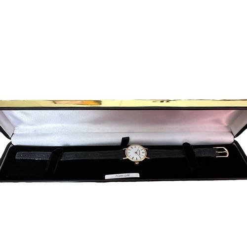 122 - A Bueche Girod Swiss-made 9ct gold ladies wristwatch, white dial with Roman numerals and black strap... 