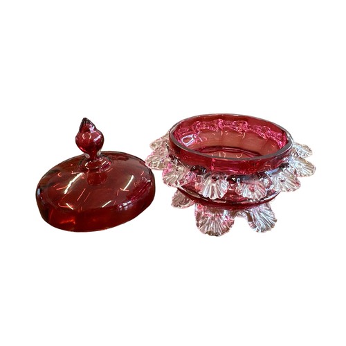 354 - Victorian Cranberry Glass lidded sugar bowl, with petal exterior design (13 petals). Stood on six fe... 