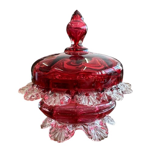 354 - Victorian Cranberry Glass lidded sugar bowl, with petal exterior design (13 petals). Stood on six fe... 