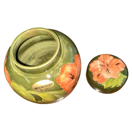 196 - Moorcroft – A Moorcroft Hibiscus pattern ginger jar, WM painted initials and Made in England imprint... 