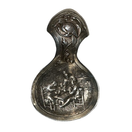 140 - Dutch Silver caddy spoon with traditional figural design, interior scene to main part of spoon and b... 