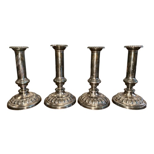 157 - Four Sheffield Plate silver plated candle sticks. Height 19.5cm. (4)