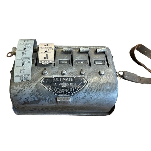 338 - Automaticket Ltd London bus ticket machine, housed in tin with partially attached leather strap. ‘Ul... 