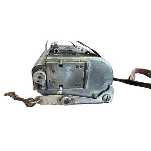 338 - Automaticket Ltd London bus ticket machine, housed in tin with partially attached leather strap. ‘Ul... 