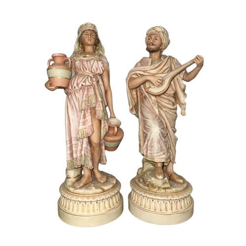 308 - Royal Dux, Pair of Arabian Figurines to include; Arabian Water Carrier figurine, model No. 81. Appea... 