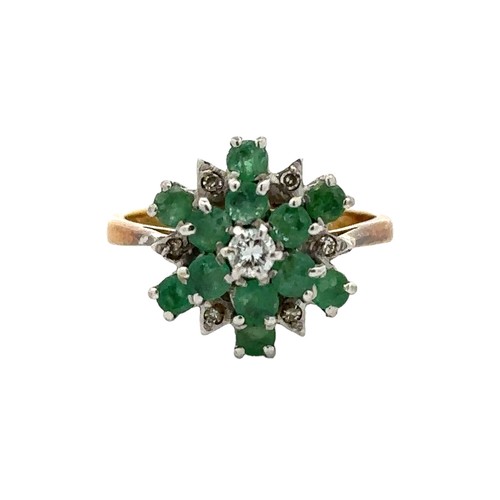 34 - An 18ct gold emerald and diamond flower ring. Size K. Total weight 3.67g. 1977 London hallmarks.

Pl... 