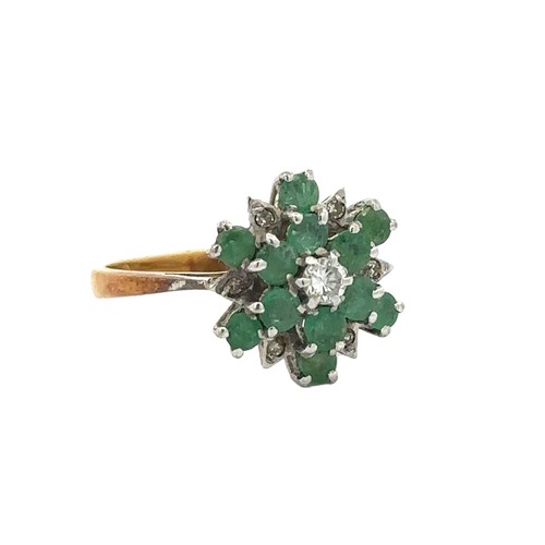 34 - An 18ct gold emerald and diamond flower ring. Size K. Total weight 3.67g. 1977 London hallmarks.

Pl... 