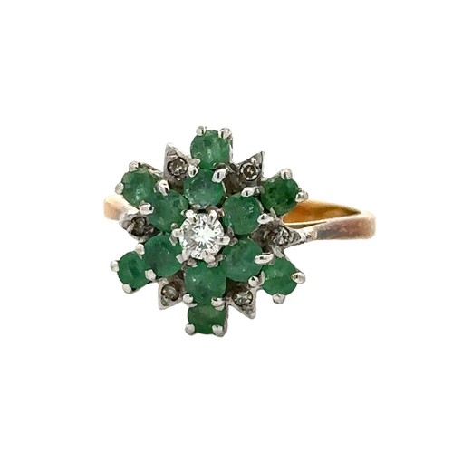 34 - An 18ct gold emerald and diamond flower ring. Size K. Total weight 3.67g. 1977 London hallmarks.

Pl... 