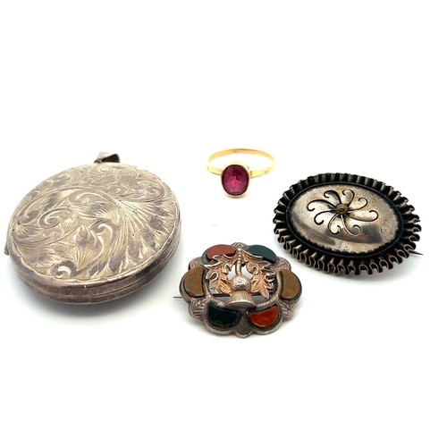 93 - A small selection of jewellery including a large silver locket (length 67mm), a white metal agate th... 