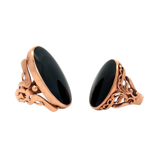 68 - Two 9ct gold rings set with oval black cabochons. Larger ring    size O, dimensions 32mm x 16 mm. Sm... 