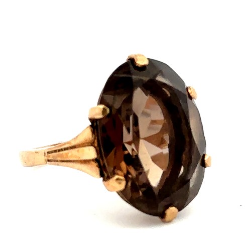 69 - An oval faceted smoky quartz ring, hallmarked 9ct. Smoky quartz approx 20mm x 15mm. Size O. Weight 6... 