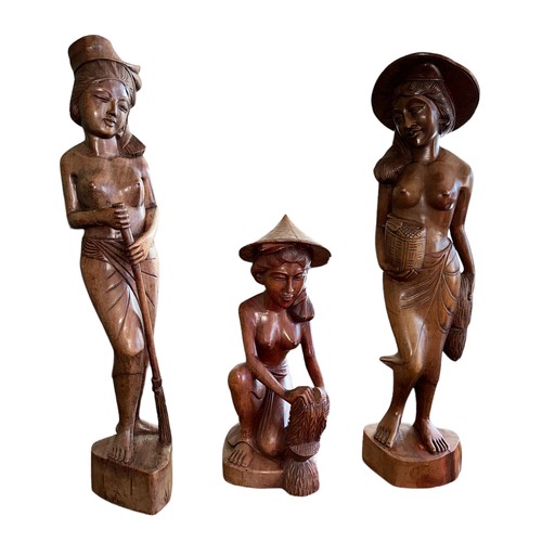 327 - Five Balinese carved wooden female figures. The two standing figures approx. 59cm tall and the kneel... 