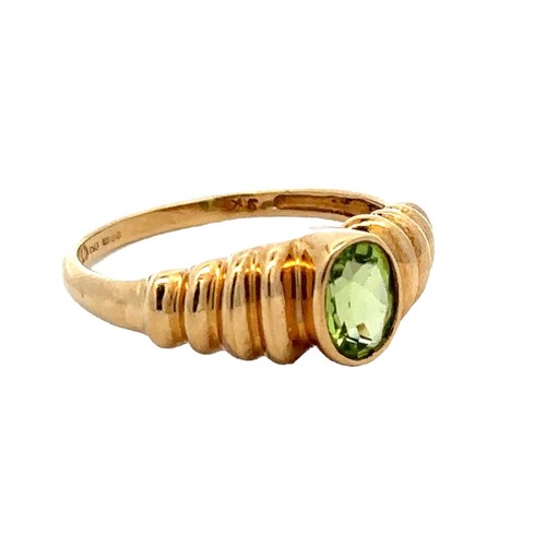 56 - An oval peridot 9ct gold ring, size Q. Weight 2.58g.

Please see the buyer's terms and conditions fo... 