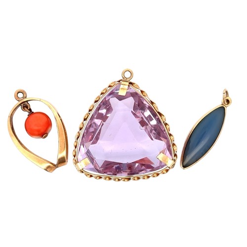 57 - A 9ct gold purple paste triangular pendant, a 9ct marquise shaped purple jade pendant and a yellow m... 