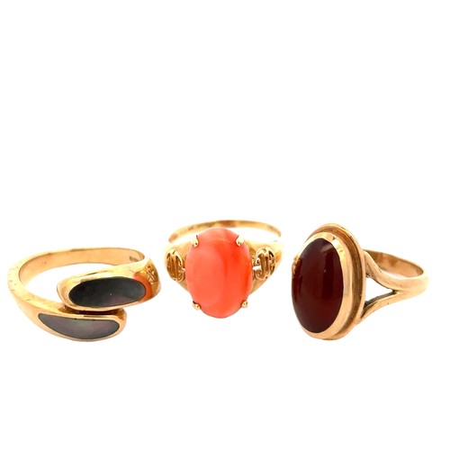 58 - Three gem set gold rings, sizes P-Q.  A 14ct agate ring, 3.4g. A 9ct carnelian ring and a 9ct abalon... 