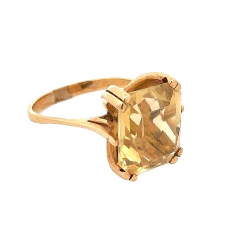 59 - An octagonal cut citrine yellow metal ring, size N.  Citrine dimensions 14mm x 12mm.  Condition - sc... 