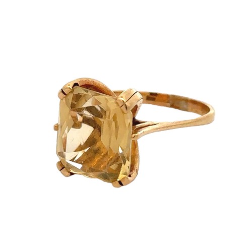 59 - An octagonal cut citrine yellow metal ring, size N.  Citrine dimensions 14mm x 12mm.  Condition - sc... 