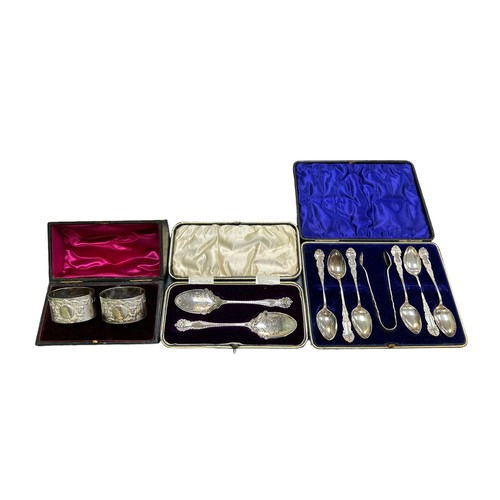 154 - Range of silver items to include napkin rings, spoons etc, with a boxed pair of napkin rings hallmar... 