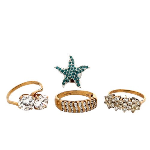 51 - Three 9ct gold paste/ CZ rings and a starfish white metal and CZ pin brooch. Total weight of rings 9... 