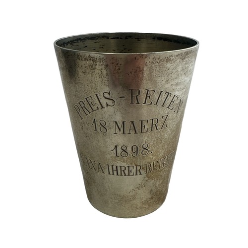 155 - A continental silver cup, approx 92mm in height. Inscribed 'Preis-Reiten 18 Maerz 1898  Nana Ihrer R... 