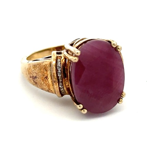 5 - A large ruby and silver gilt ring with white stone shoulders.  stamped 925. Size O. Ruby is treated ... 