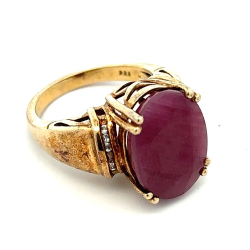 5 - A large ruby and silver gilt ring with white stone shoulders.  stamped 925. Size O. Ruby is treated ... 