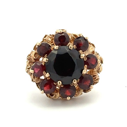 33 - A garnet cluster ring set in 9ct gold, Birmingham hallmarks. Size N. Weight 7.58g.

Please see the b... 