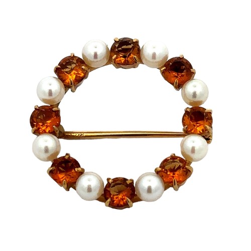 13 - A citrine and cultured pearl 9ct gold circlet brooch. 27mm in diameter. Weight 4.8g.

Please see the... 