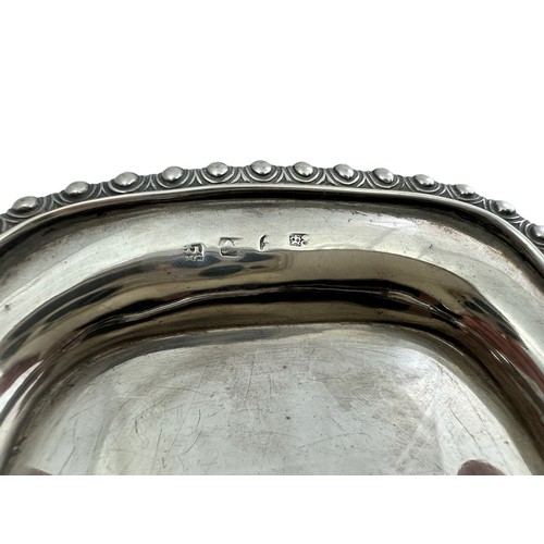 126 - A silver cream jug and tray. Cream jug, 15cm in length, by S Lesser & Sons Ltd, Birmingham 1929. Tra... 